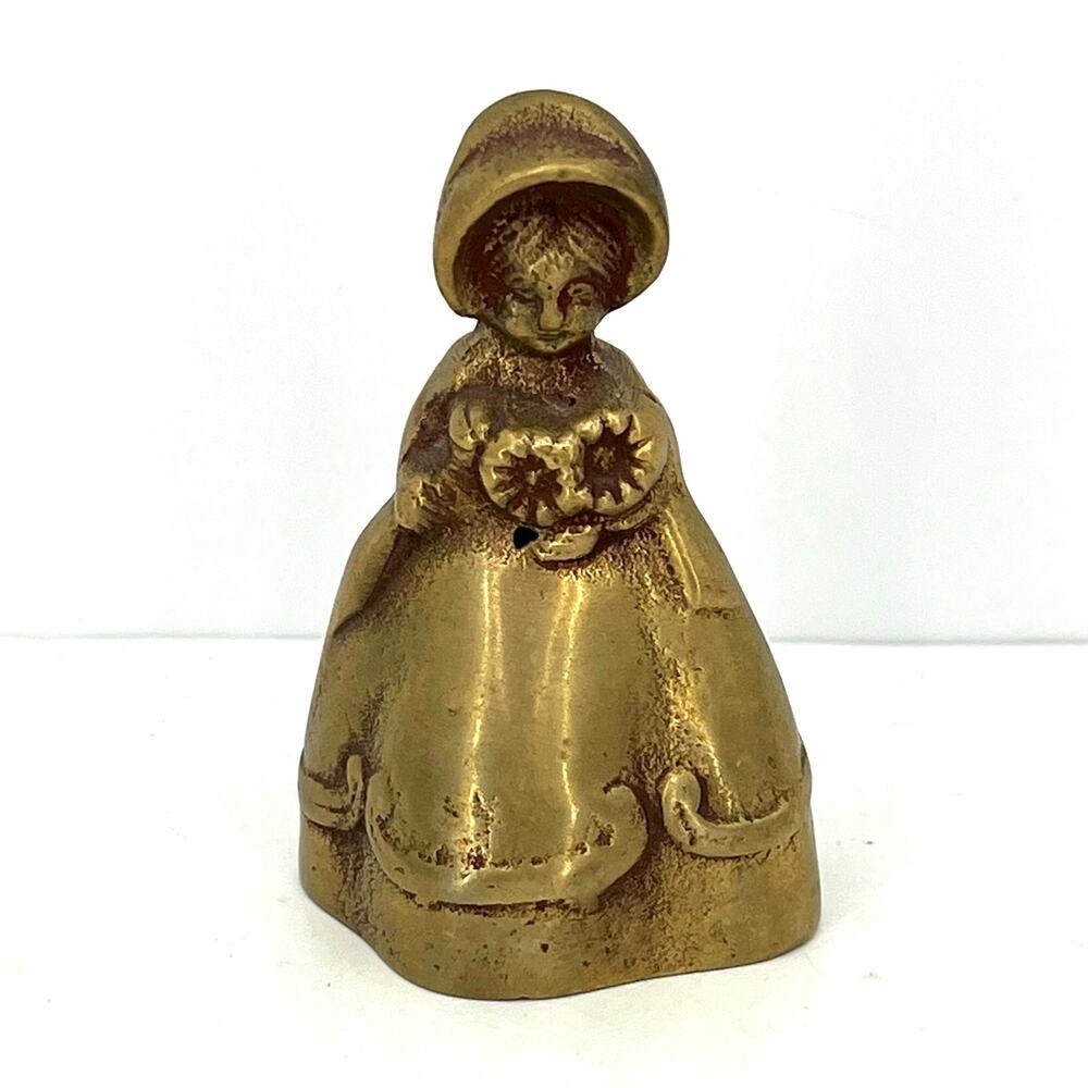 Vintage solid brass little Victorian girl holding flowers